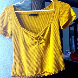 Gold low neck tied crop top